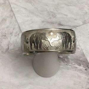 Silver tone cuff elephant bangle.